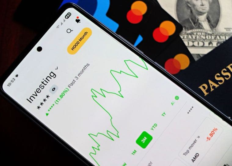 An investing app showing a rising index chart on a phone
