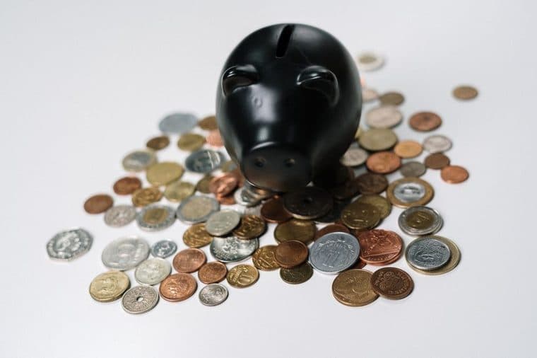 A glass jar of coins growing, representing compulsory superannuation